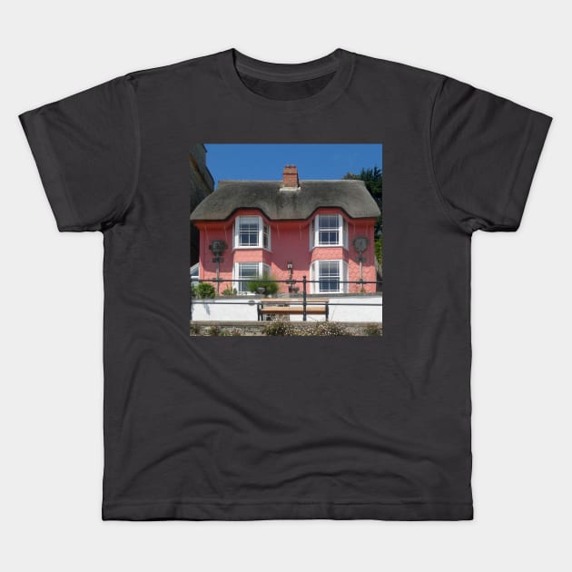 Lyme Regis, Library Cottage. Kids T-Shirt by JonDelorme